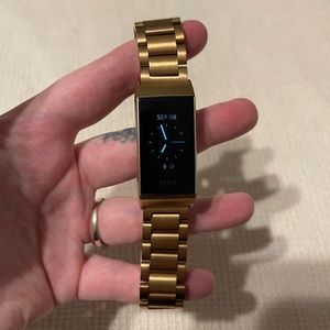 Sold! Fitbit Charge 3 with Rose Gold Finish with two bands.